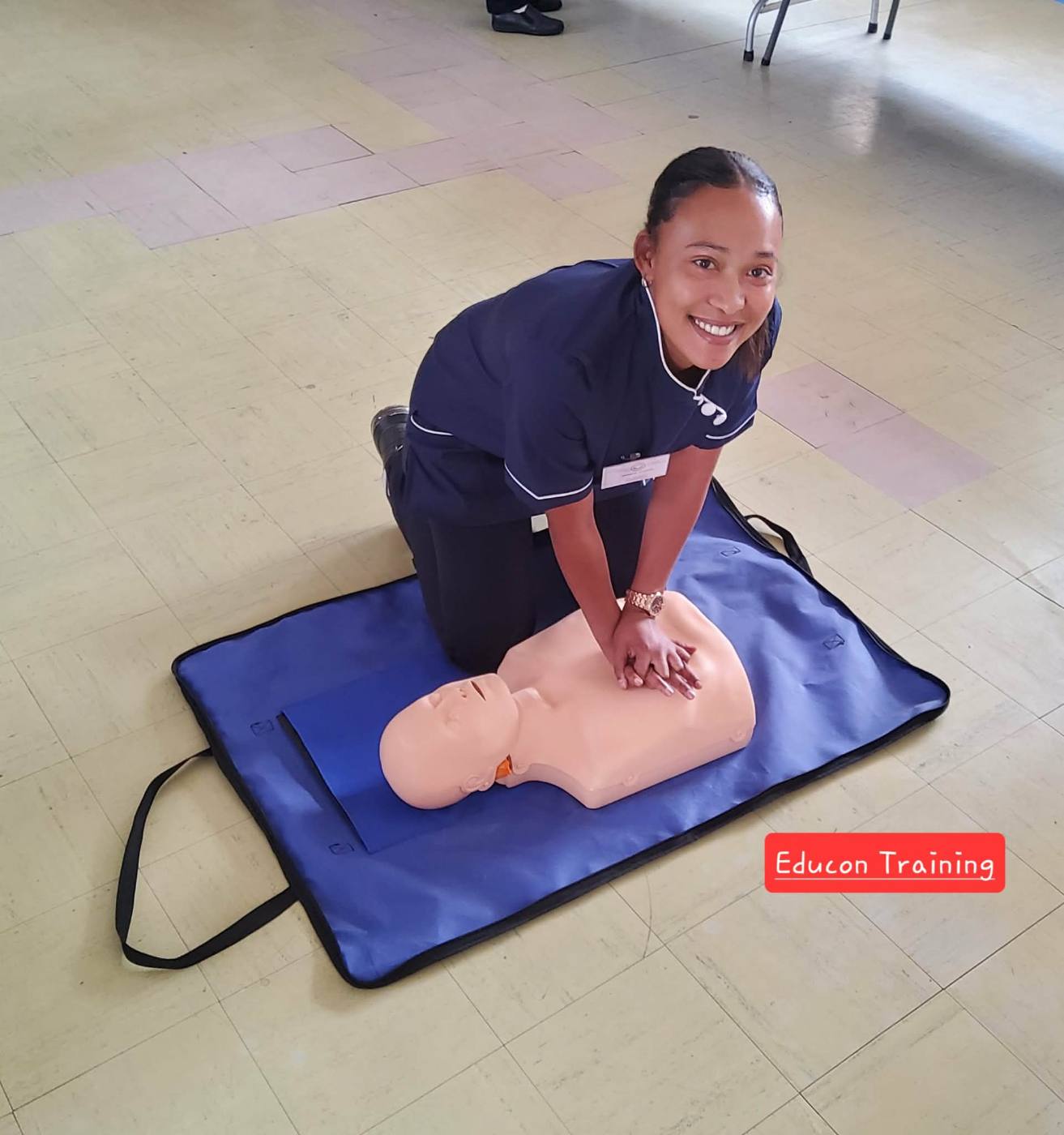 Student practising CPR on a manikin