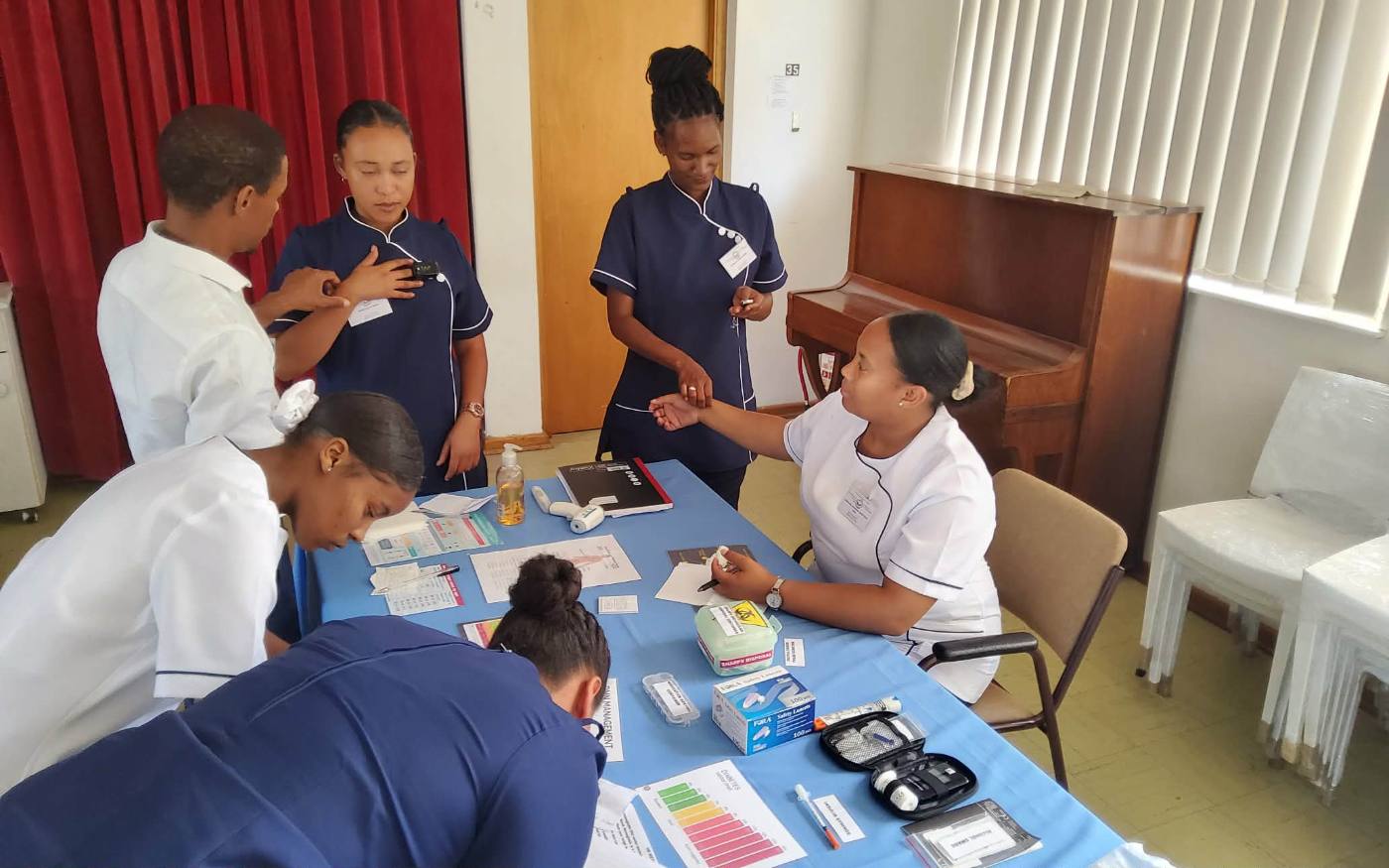 Students practising vital signs measurement