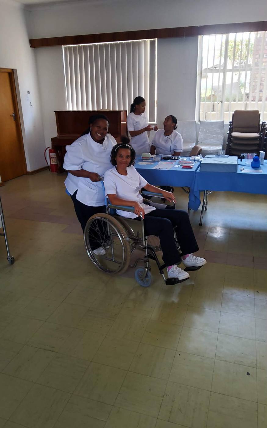 Students practising wheelchair mobility assistance